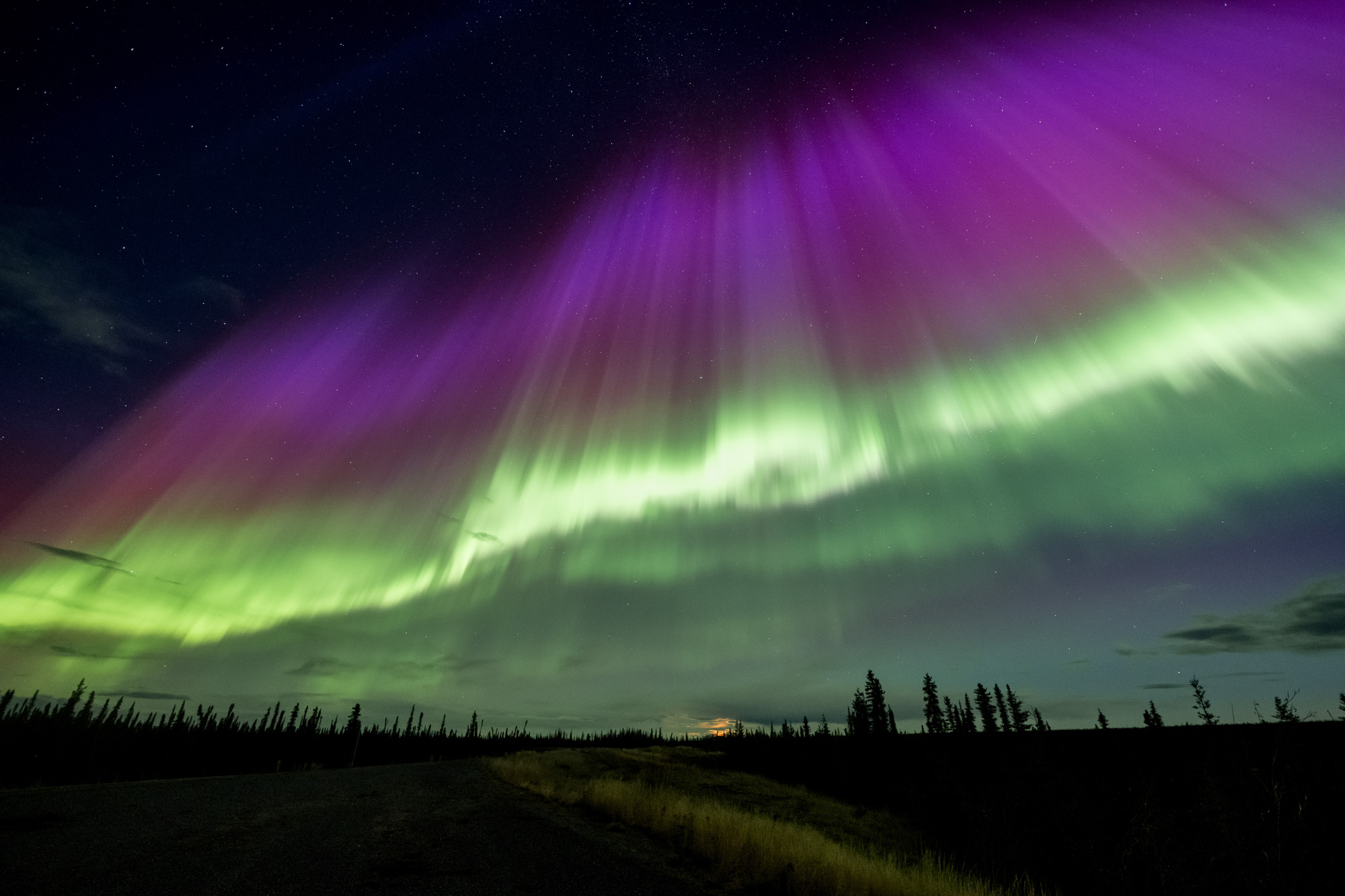 Wide aurora curtains over Alaska