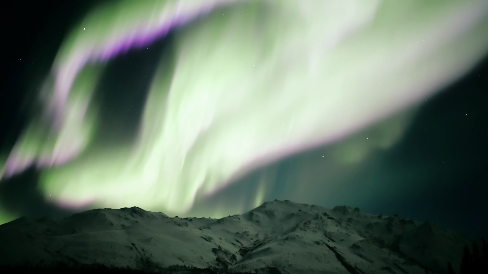 Aurora over Alaskan mountains