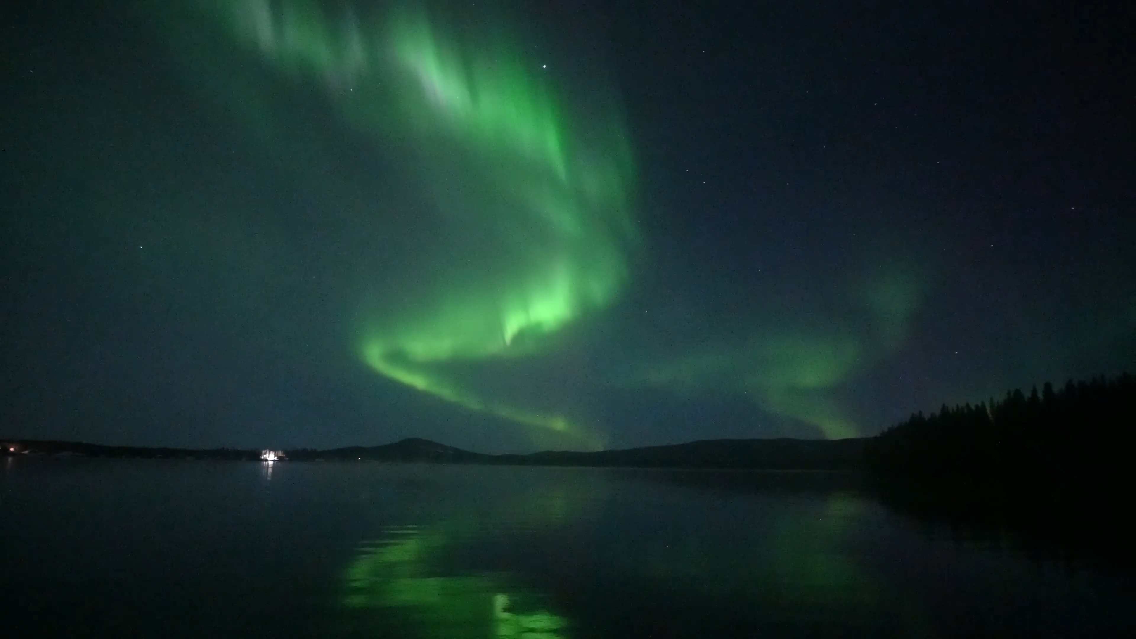 Real time video of aurora borealis reflected on Birch Lake, Alaska.