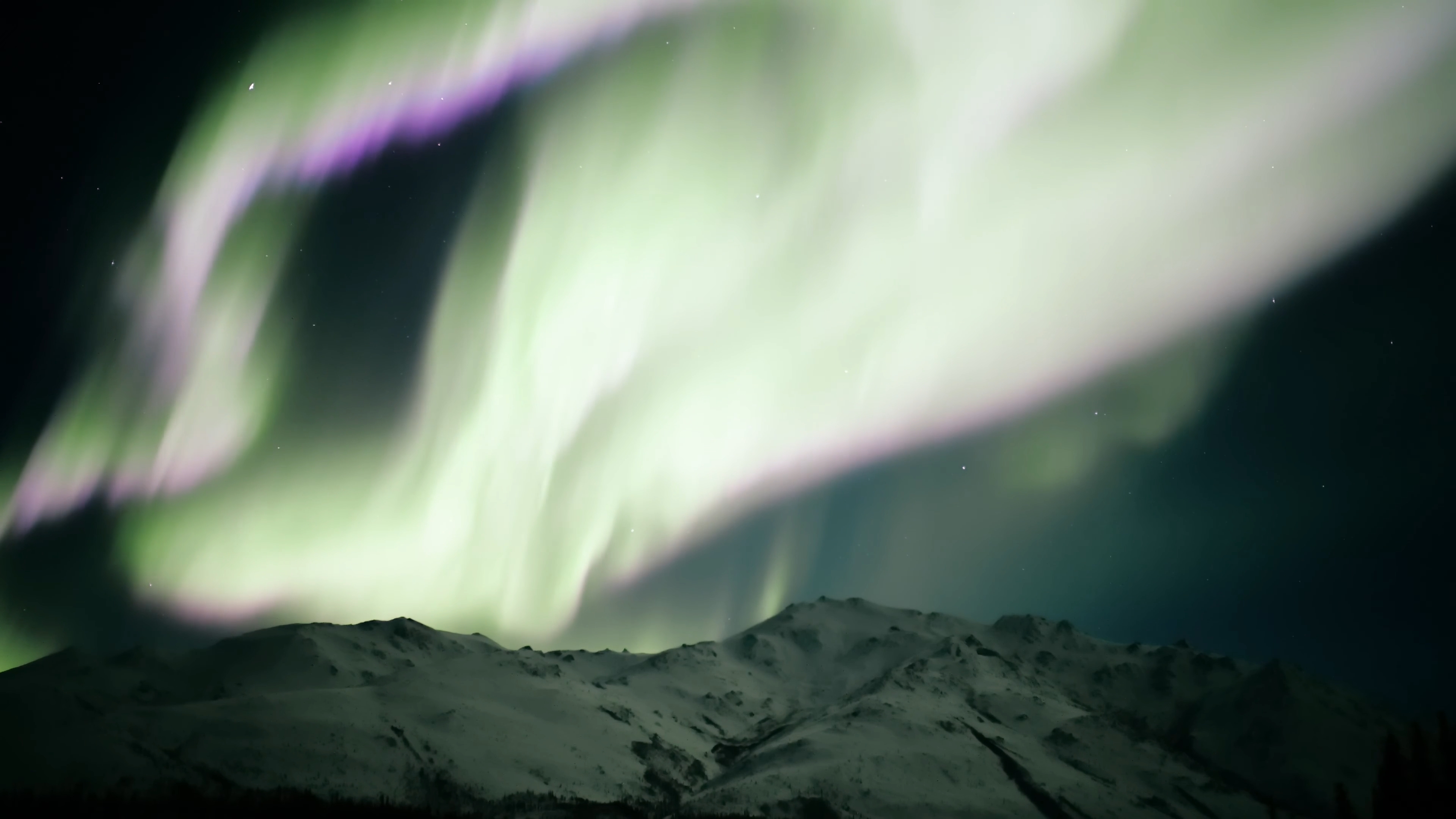 Real time video of aurora borealis substorm over the Brooks Range near Wiseman, Alaska.